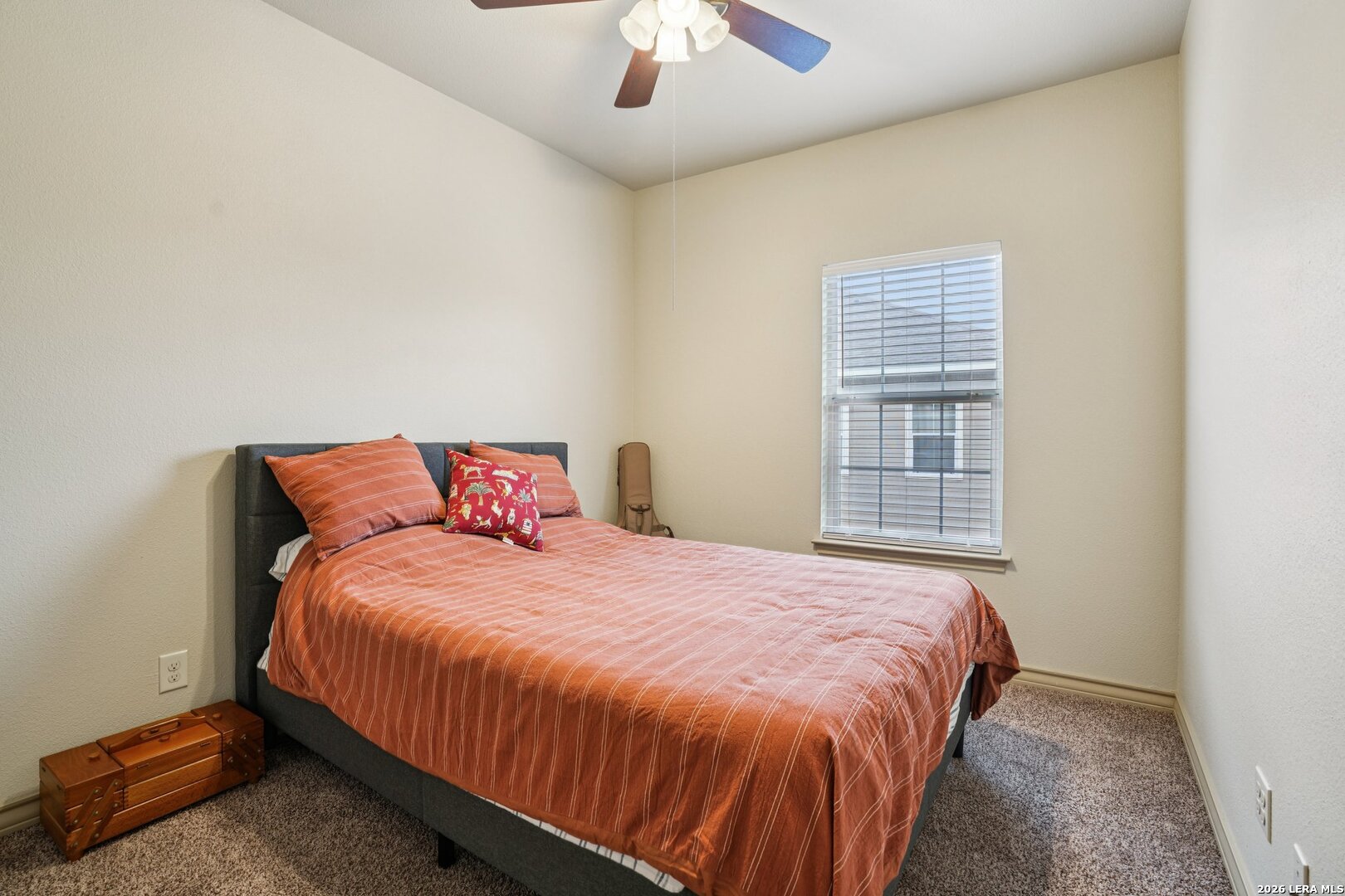 2312 Sailing Way, Unit A Kerrville, TX 78028 - Photo 20 of 29 a bedroom with a bed and a chandelier