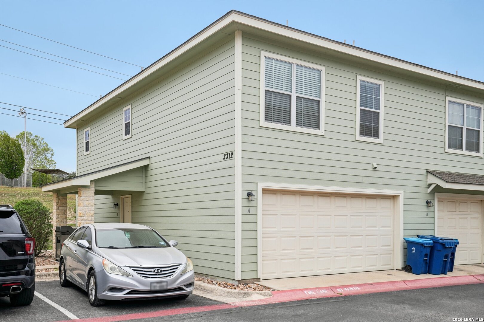 2312 Sailing Way, Unit A Kerrville, TX 78028 - Photo 2 of 29 a car parked in front of white house