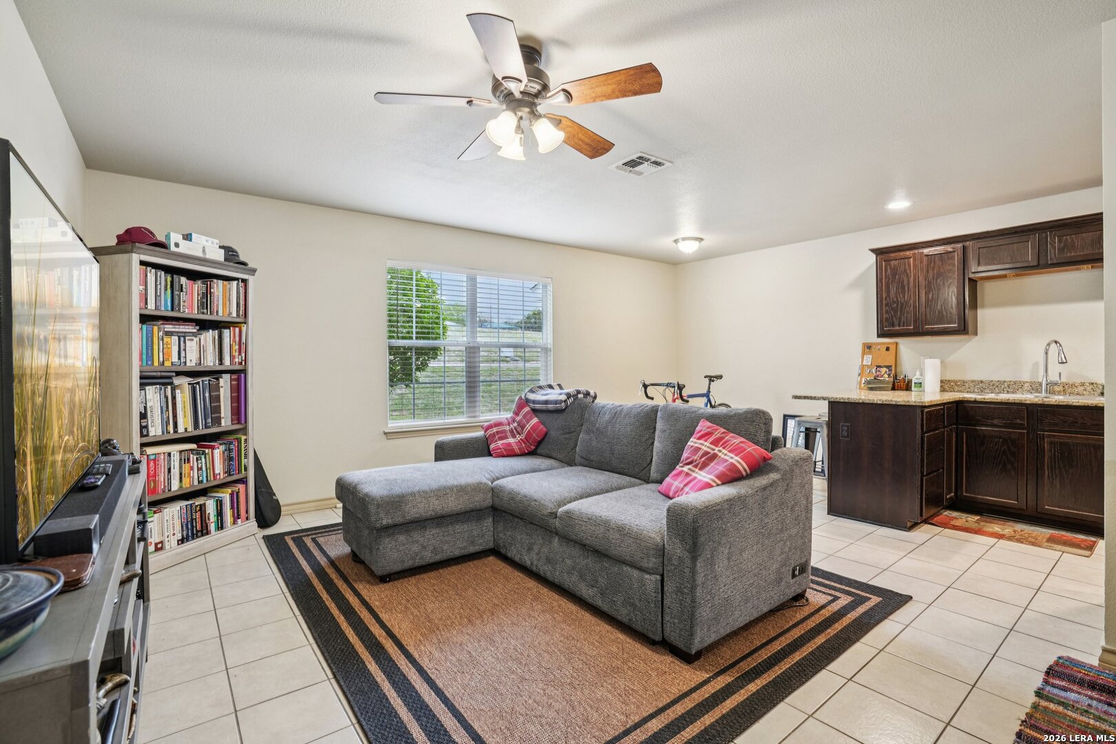 2312 Sailing Way, Unit A Kerrville, TX 78028 - Photo 6 of 29 a living room with furniture and a book shelf