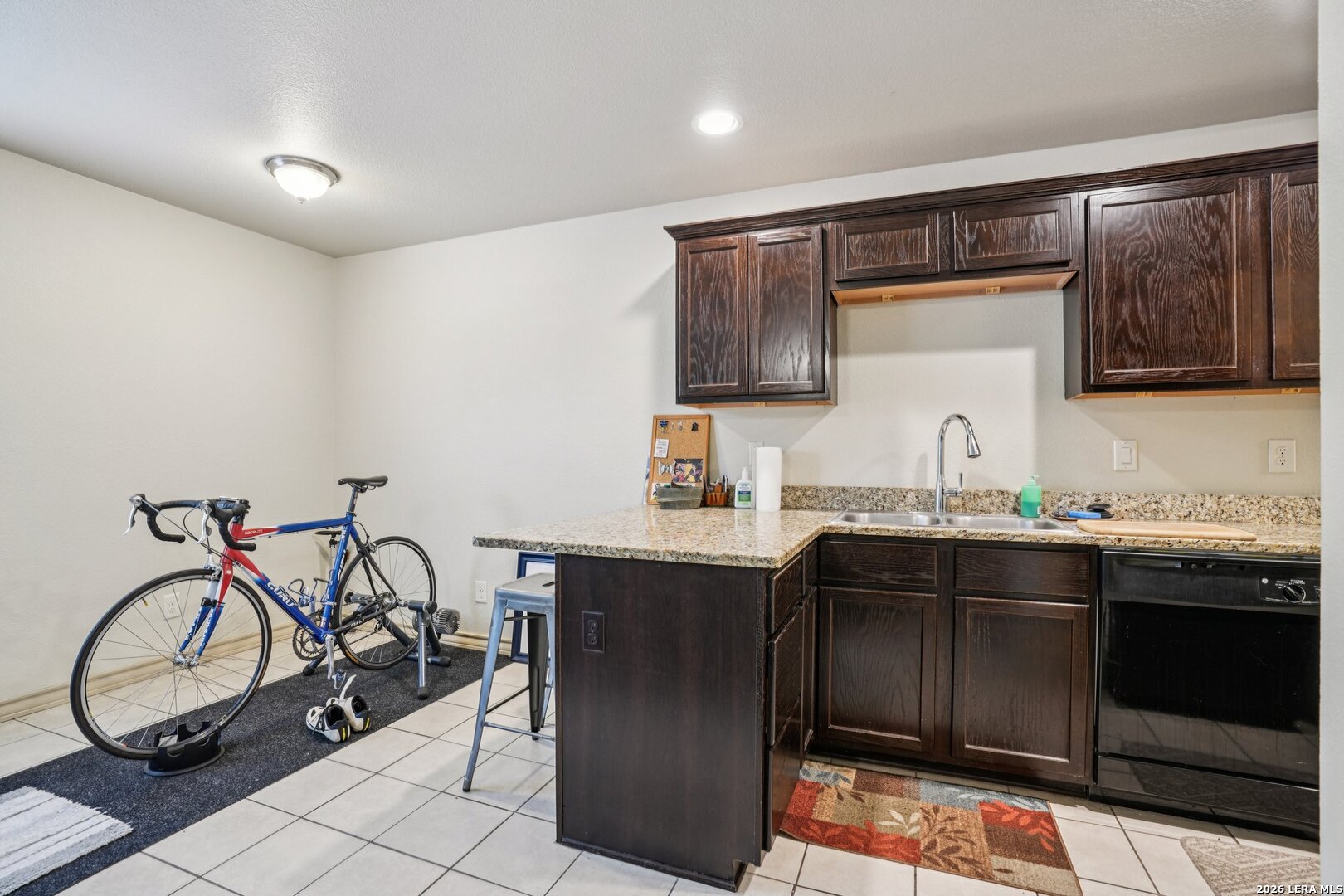 2312 Sailing Way, Unit A Kerrville, TX 78028 - Photo 10 of 29 a kitchen with a sink a stove and chairs