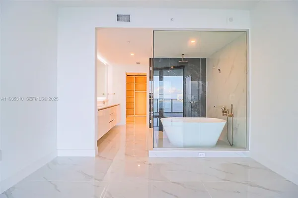 a bathroom with a double vanity sink and mirror