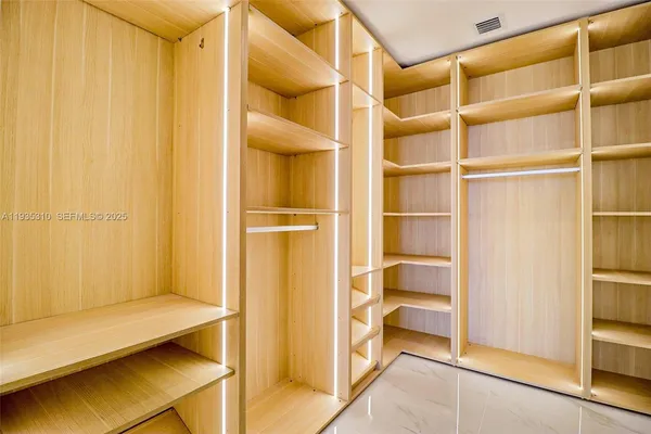 a bathroom with a shower and toilet