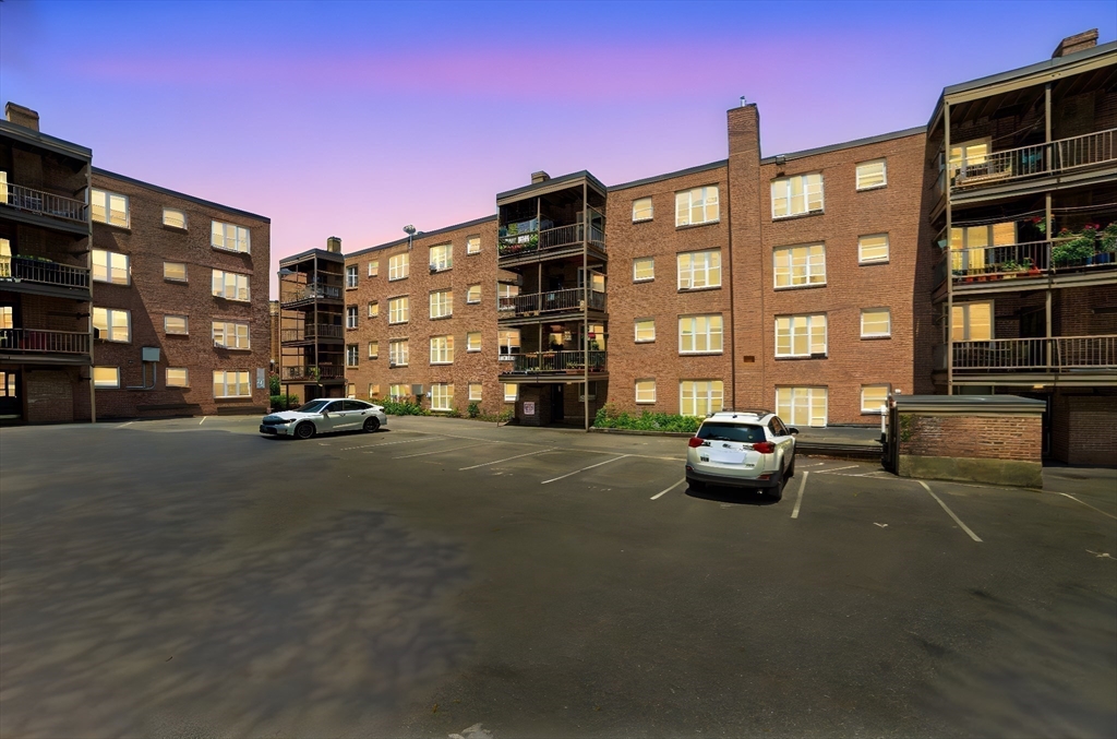 84 Strathmore Road, Unit 7 Boston, MA 02135 - Photo 16 of 17 a front view of a building with parking