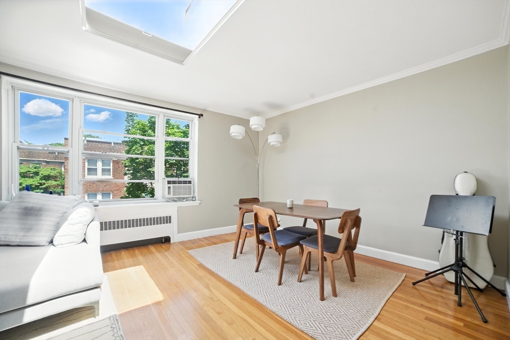 84 Strathmore Road, Unit 7 Boston, MA 02135 - Photo 4 of 17 a view of a dining room with furniture window and wooden floor