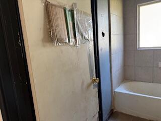1200 3rd Street Redding, CA 96002 - Photo 19 of 31 a bathroom with a tub and a shower