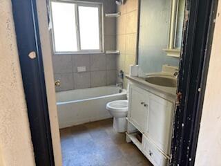 1200 3rd Street Redding, CA 96002 - Photo 26 of 31 a bathroom with a sink a toilet and bathtub