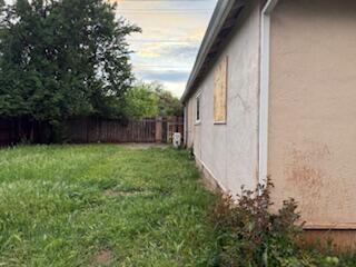 1200 3rd Street Redding, CA 96002 - Photo 6 of 31 a backyard of a house with lots of green space