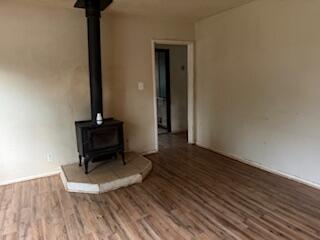 1200 3rd Street Redding, CA 96002 - Photo 9 of 31 a living room with hard wood floors and a table