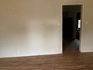 1200 3rd Street Redding, CA 96002 - Photo 10 of 31 a view of an empty room with wooden floor and a window