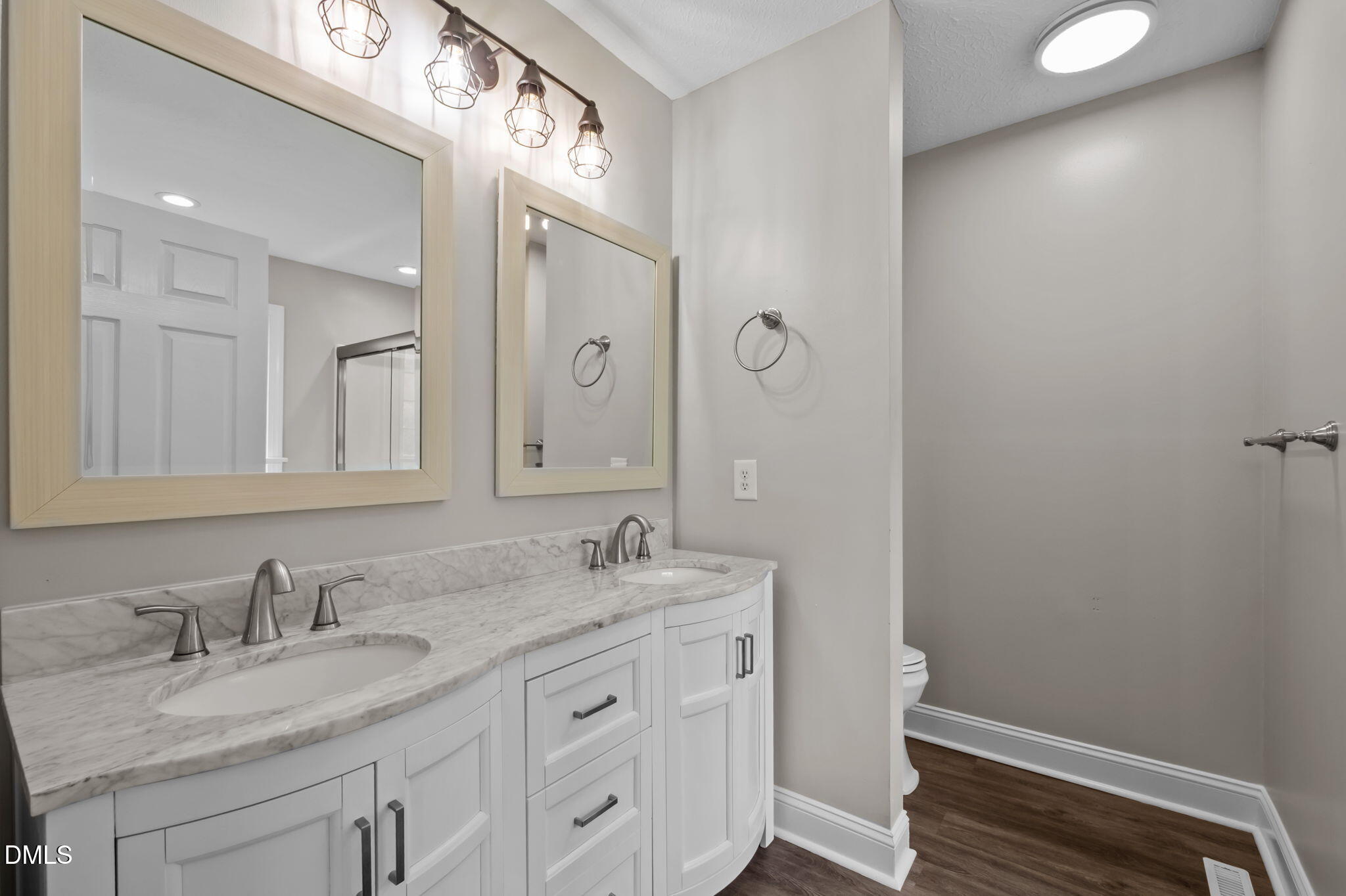 427 Fletcher Ridge Road Timberlake, NC 27583 - Photo 23 of 42 a bathroom with a granite countertop sink and a mirror