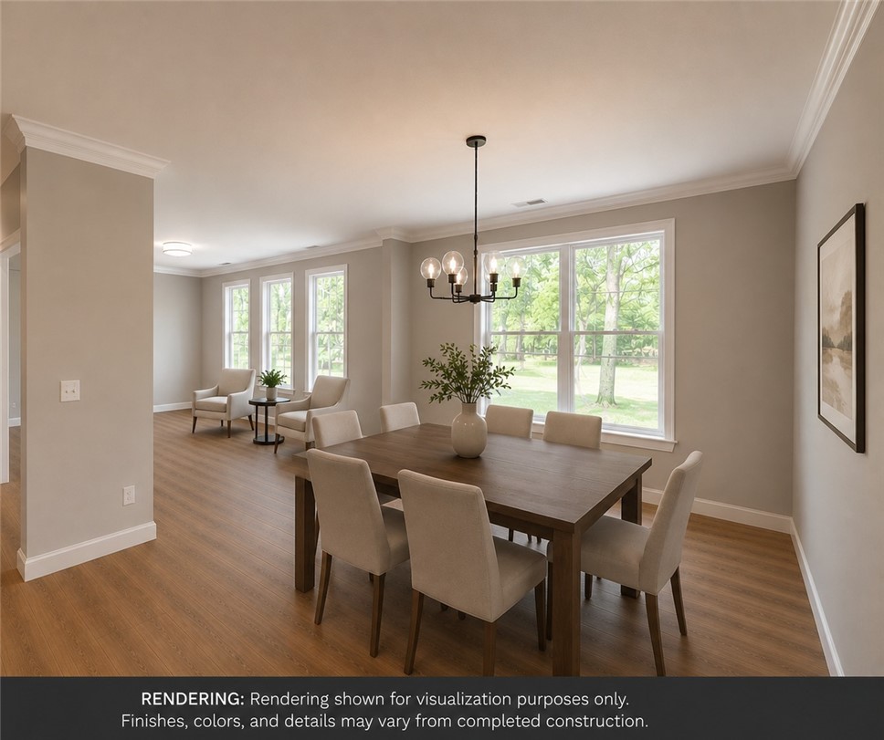 513 Quail Hollow Road Anderson, SC 29621 - Photo 3 of 39 This inviting dining area seamlessly blends with the living space, offering views of the surrounding greenery.