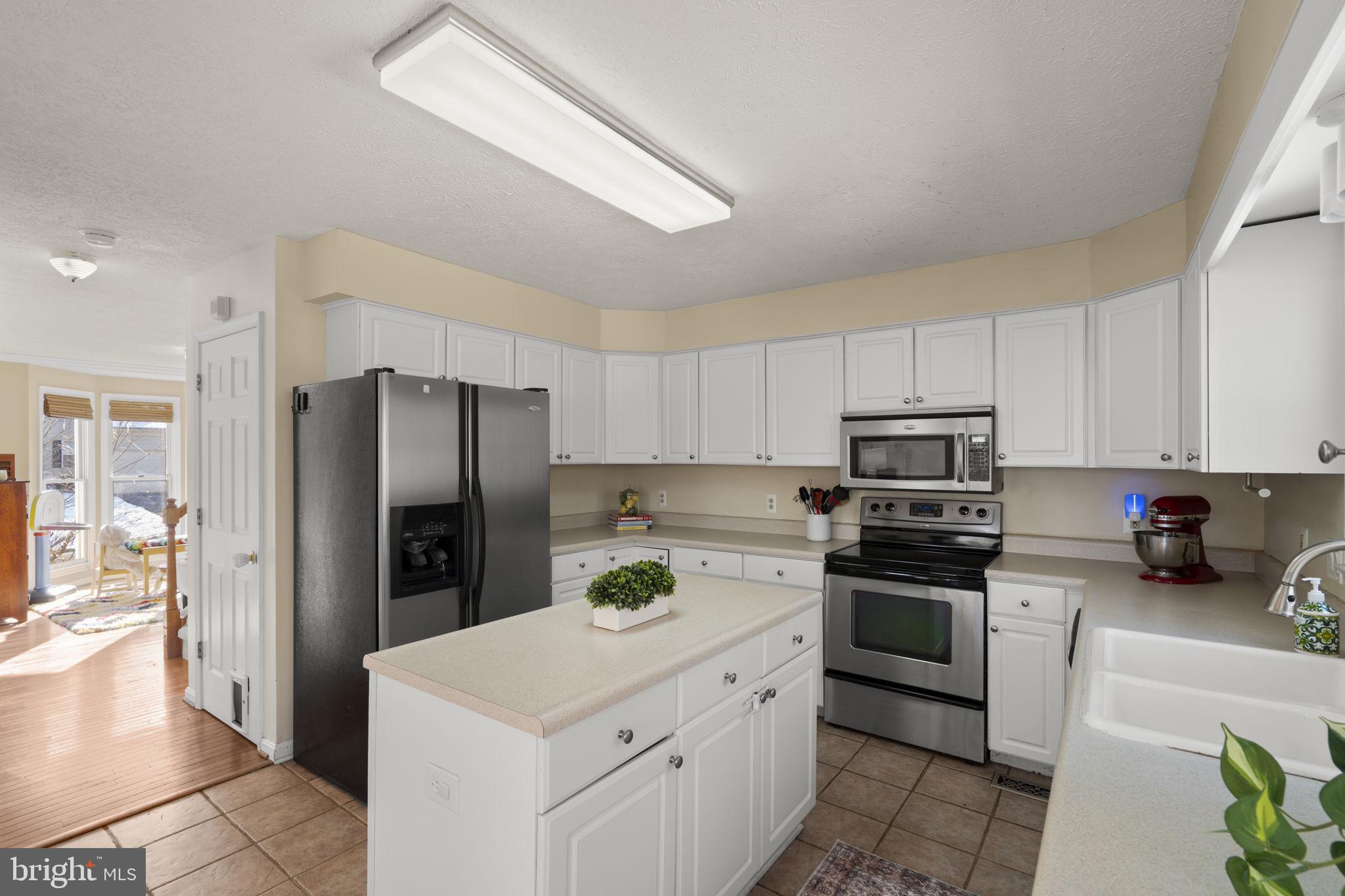 42 Lawhorn Road Stafford, VA 22554 - Photo 16 of 46 a kitchen with stainless steel appliances a refrigerator sink and microwave
