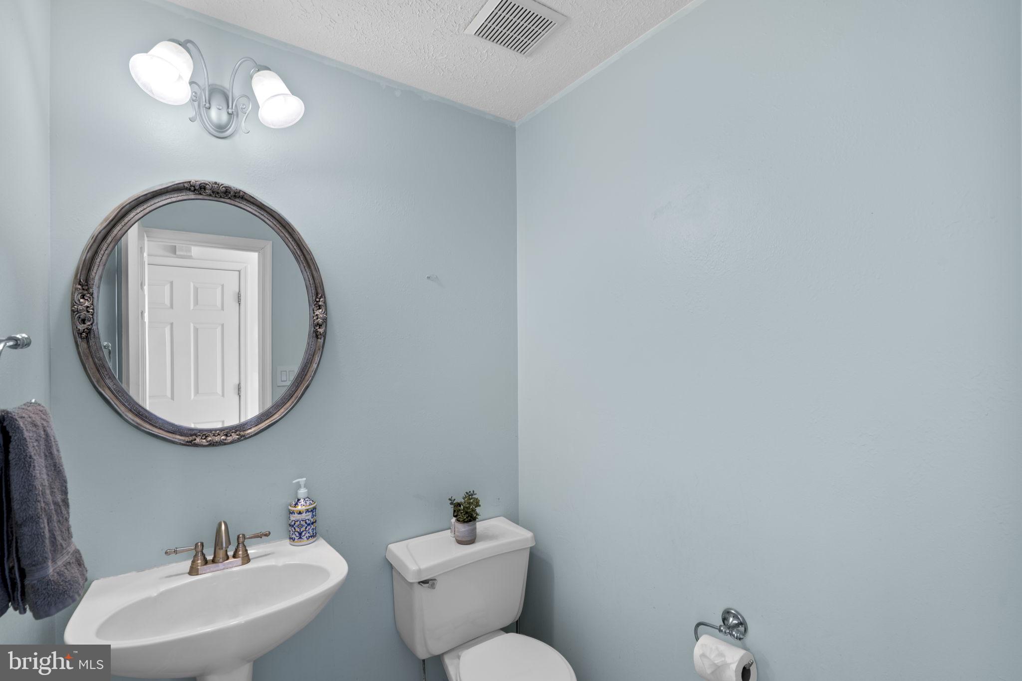 42 Lawhorn Road Stafford, VA 22554 - Photo 18 of 46 a bathroom with a toilet a sink and a mirror