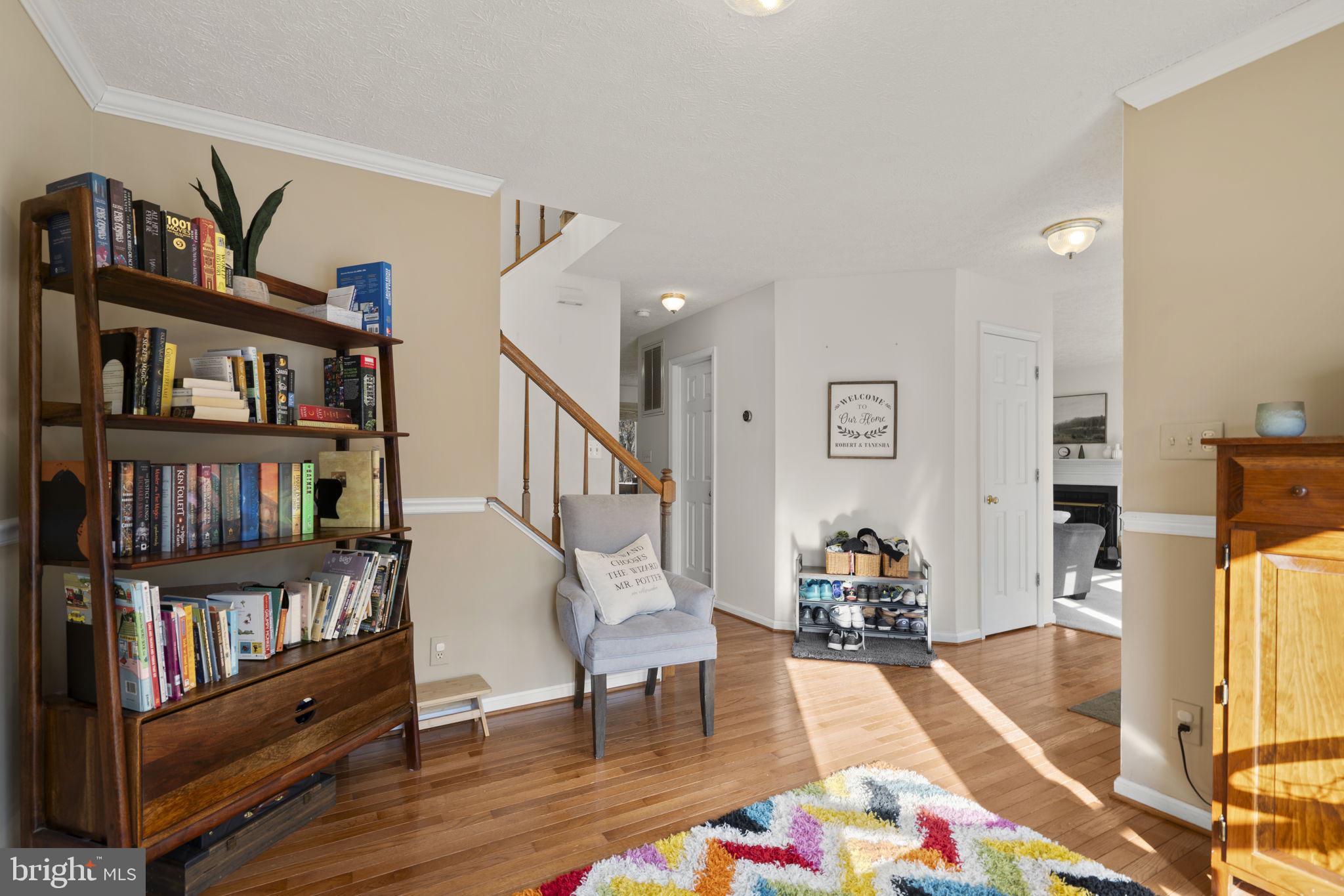 42 Lawhorn Road Stafford, VA 22554 - Photo 20 of 46 a living room with furniture and a book shelf