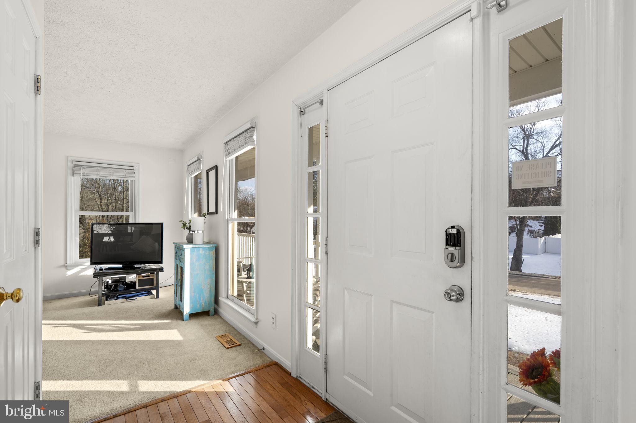 42 Lawhorn Road Stafford, VA 22554 - Photo 21 of 46 a view of a livingroom with wooden floor and a flat screen tv