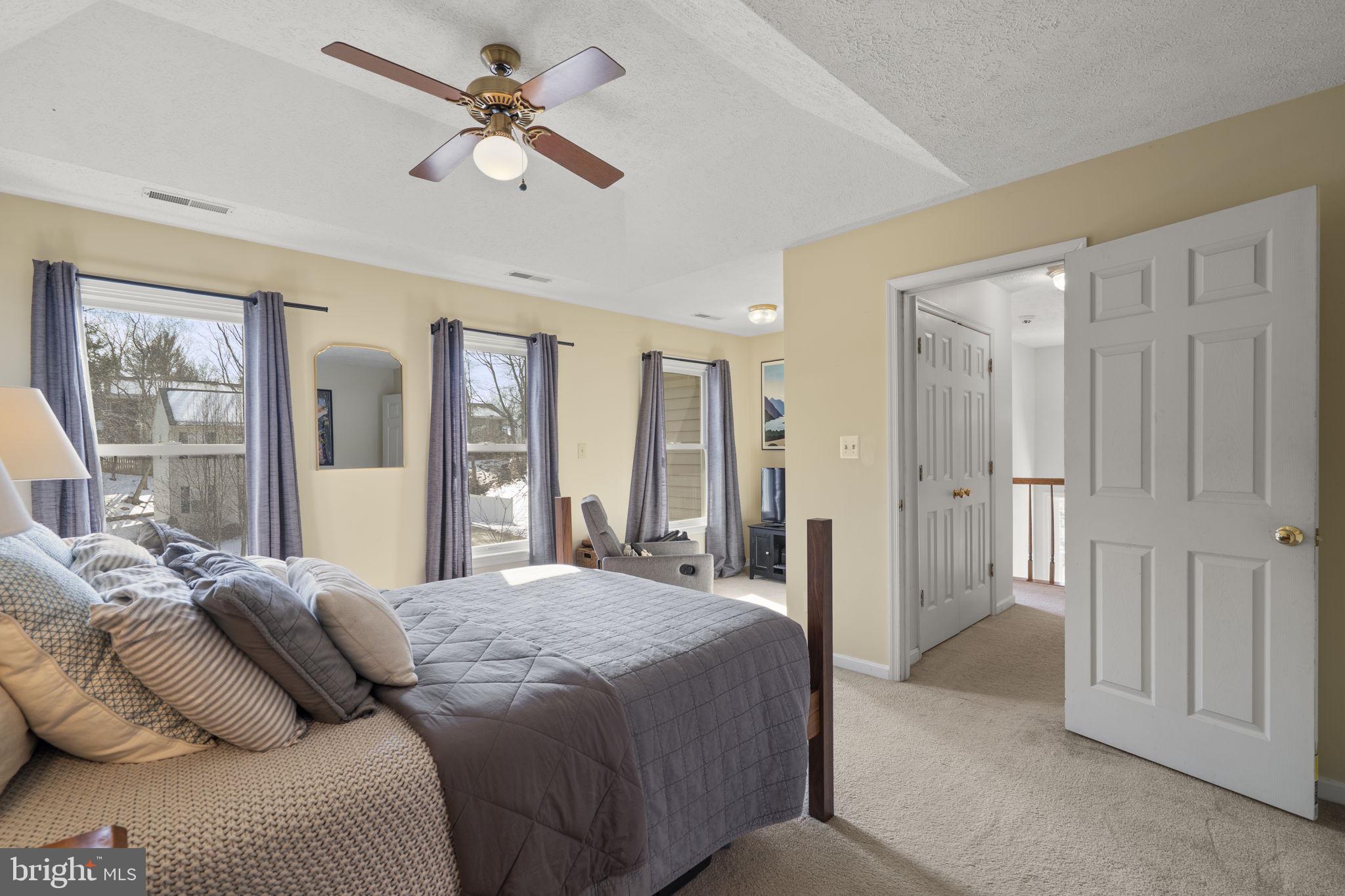 42 Lawhorn Road Stafford, VA 22554 - Photo 26 of 46 a bedroom with a large bed and a chandelier