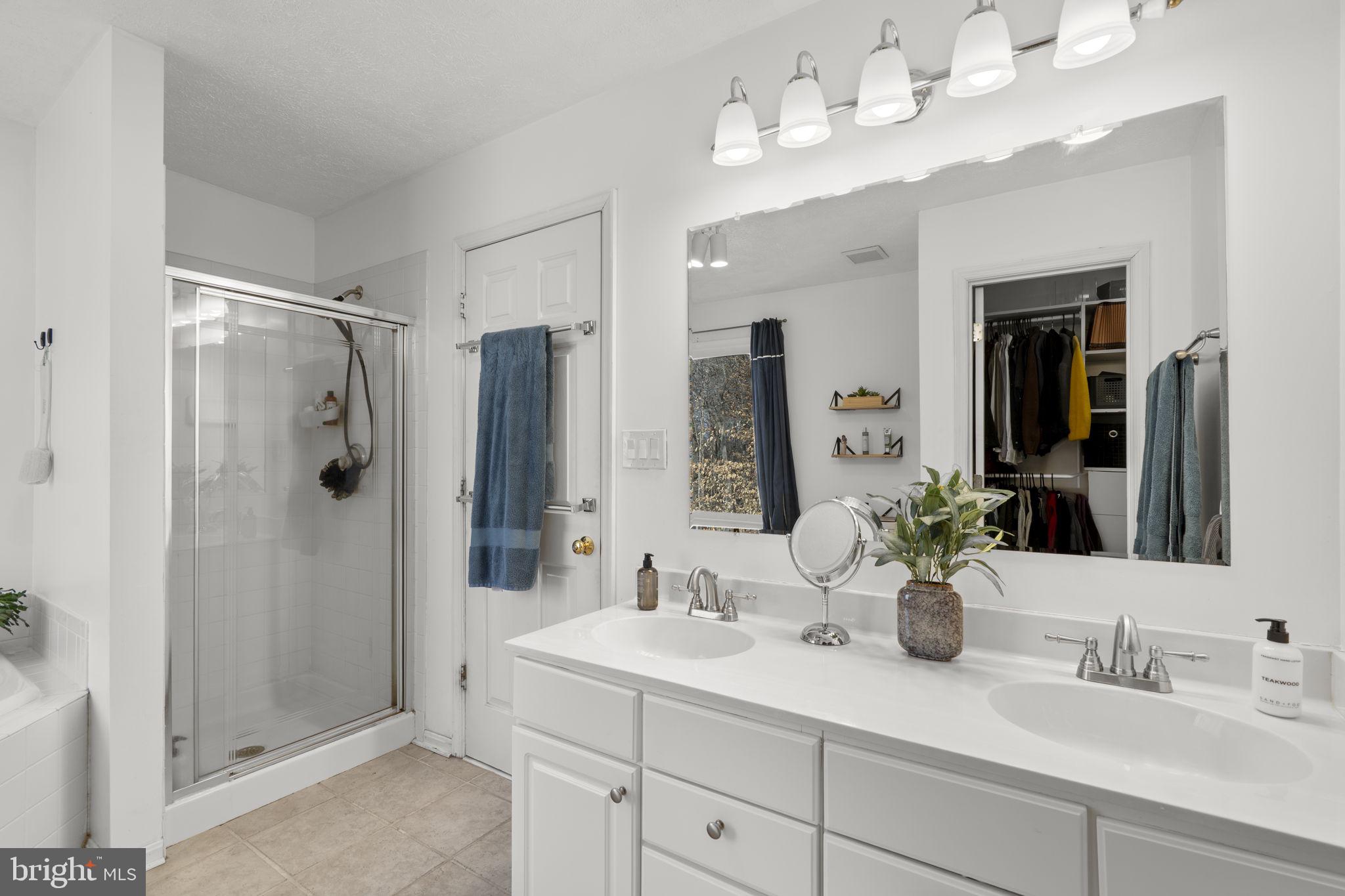 42 Lawhorn Road Stafford, VA 22554 - Photo 30 of 46 a bathroom with a sink double vanity and shower