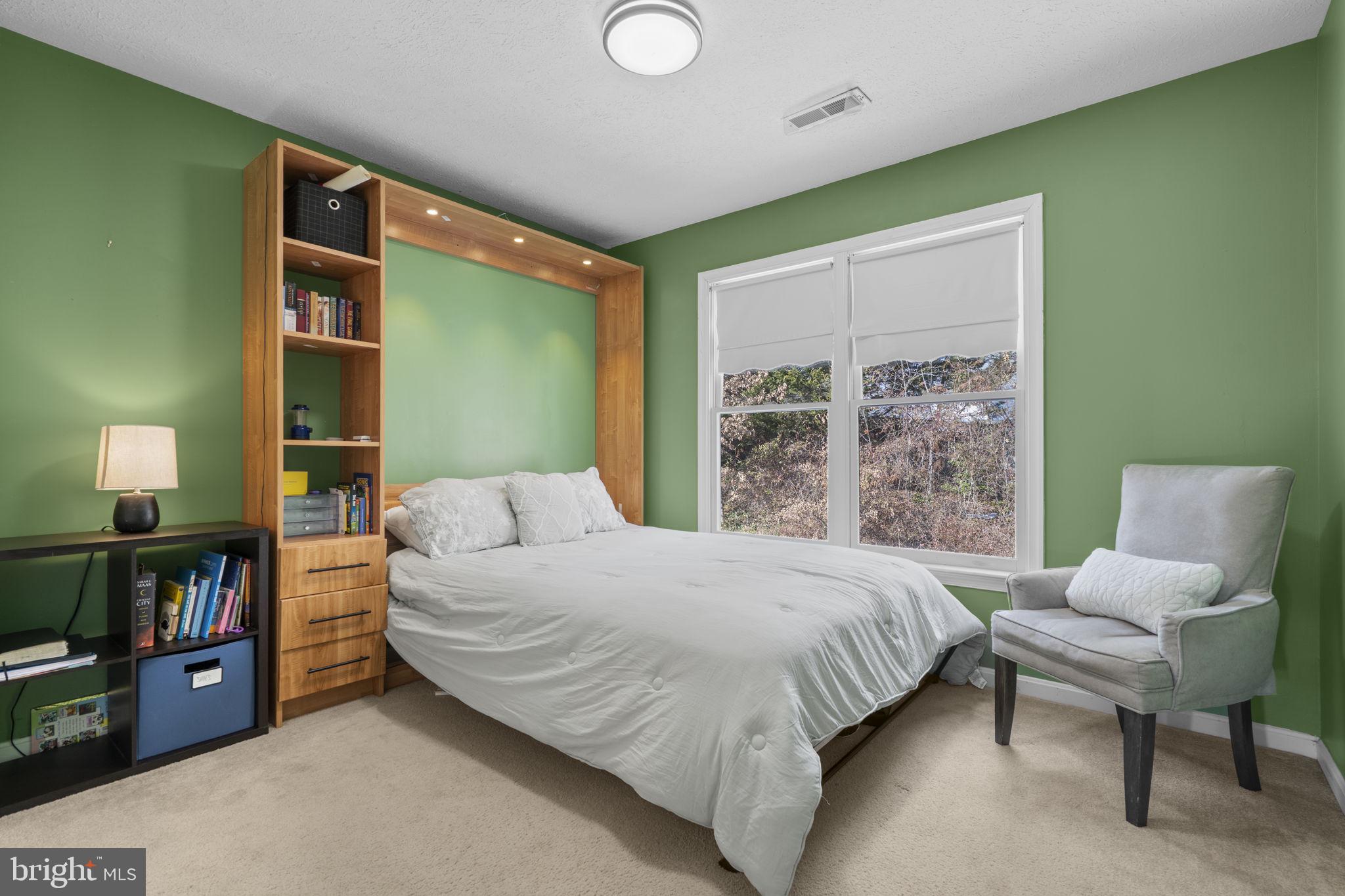 42 Lawhorn Road Stafford, VA 22554 - Photo 35 of 46 a bedroom with a bed wooden floor and a large window