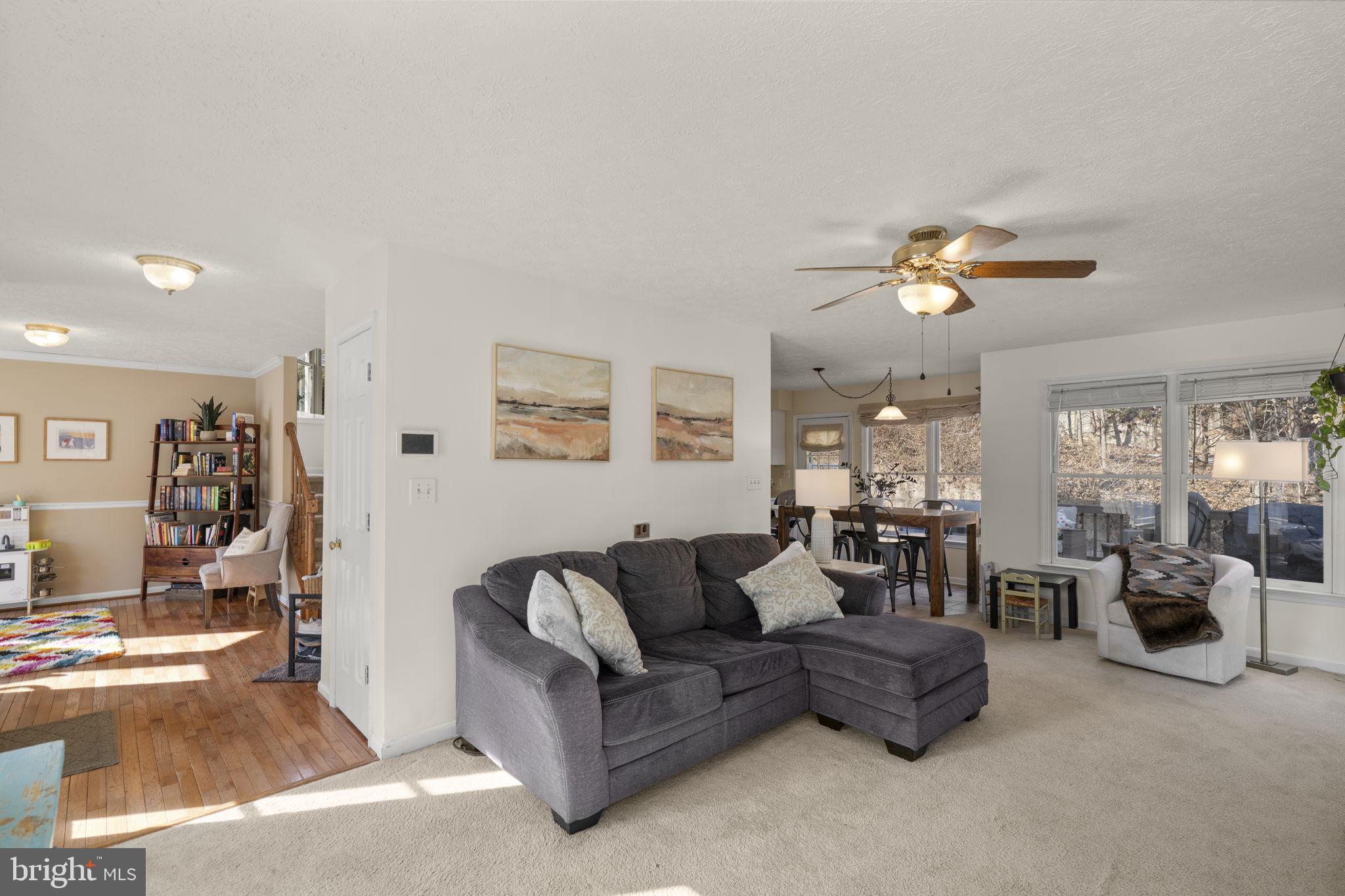 42 Lawhorn Road Stafford, VA 22554 - Photo 4 of 46 a living room with furniture and a chandelier