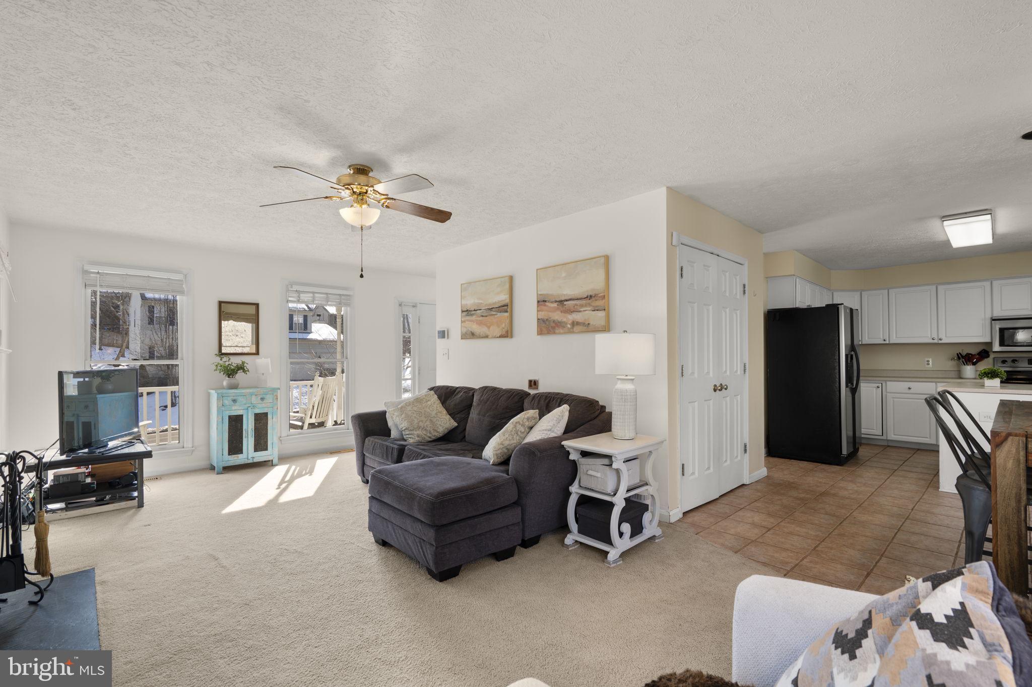 42 Lawhorn Road Stafford, VA 22554 - Photo 5 of 46 a living room with furniture and a chandelier