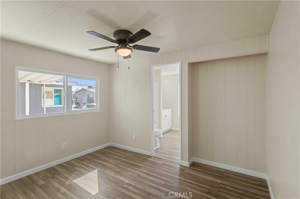 1097 North N State, Unit 194 Hemet, CA 92543 - Photo 17 of 19 a view of empty room with wooden floor and fan