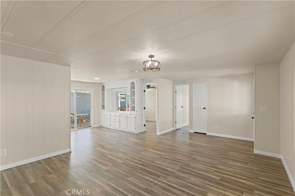 1097 North N State, Unit 194 Hemet, CA 92543 - Photo 8 of 19 wooden floor in an empty room with a window