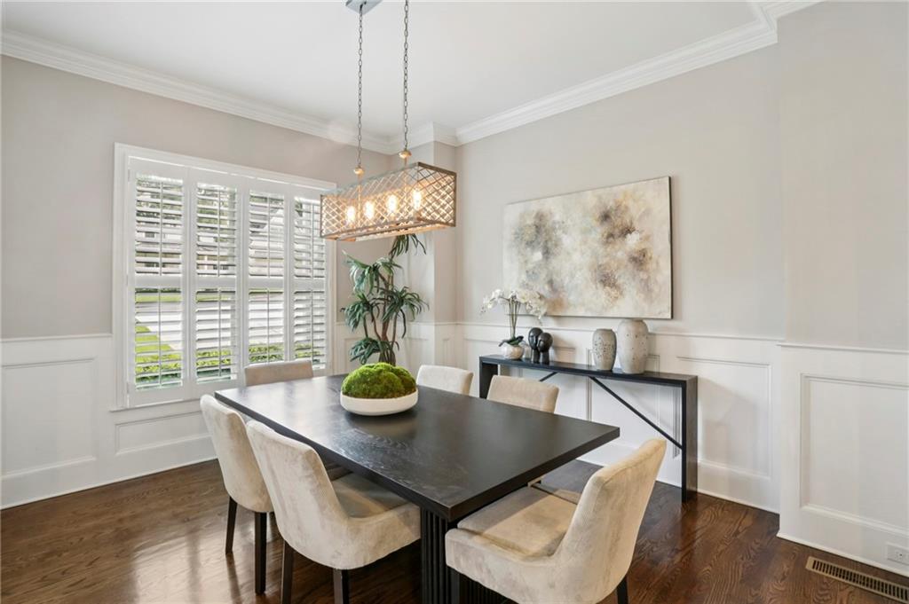 2585 Drew Valley Road Northeast Brookhaven, GA 30319 - Photo 15 of 44 a view of a dining room with furniture window and wooden floor