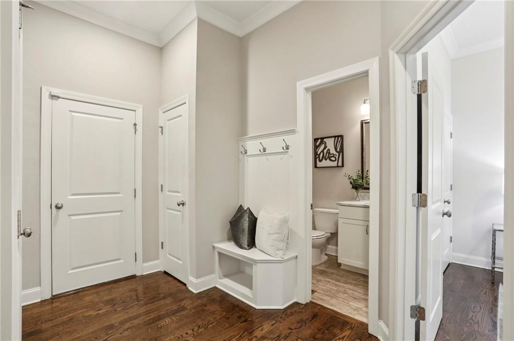 2585 Drew Valley Road Northeast Brookhaven, GA 30319 - Photo 16 of 44 a living room with a toilet and a wooden floor