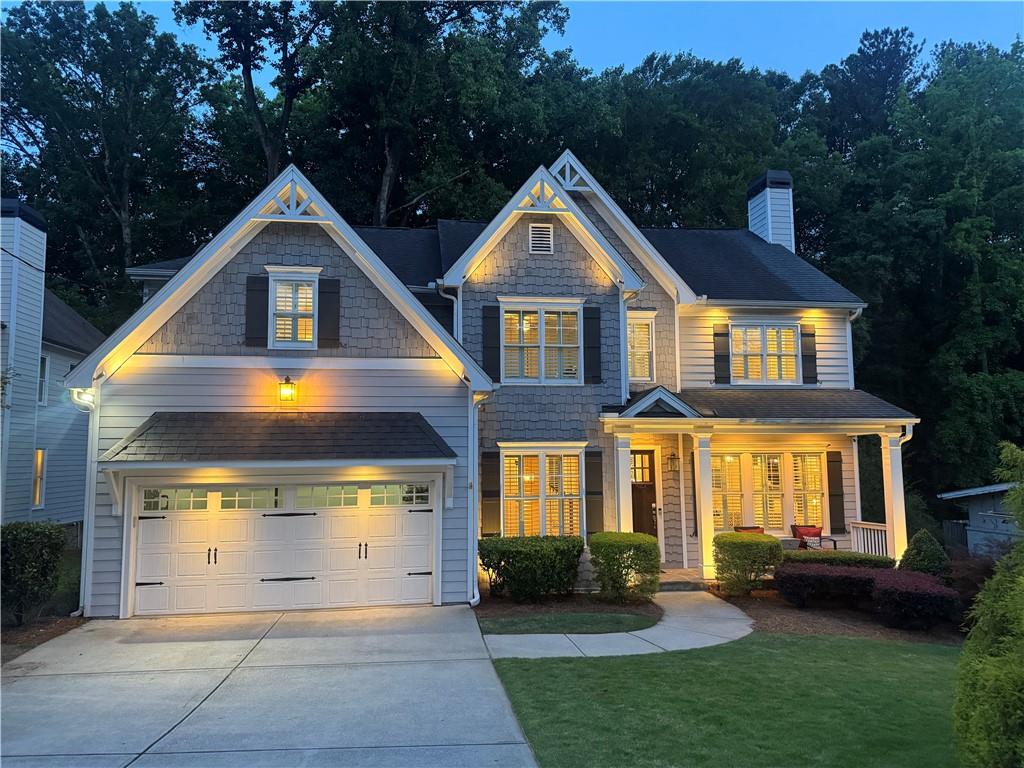 2585 Drew Valley Road Northeast Brookhaven, GA 30319 - Photo 2 of 44 a front view of a house with a yard and garage