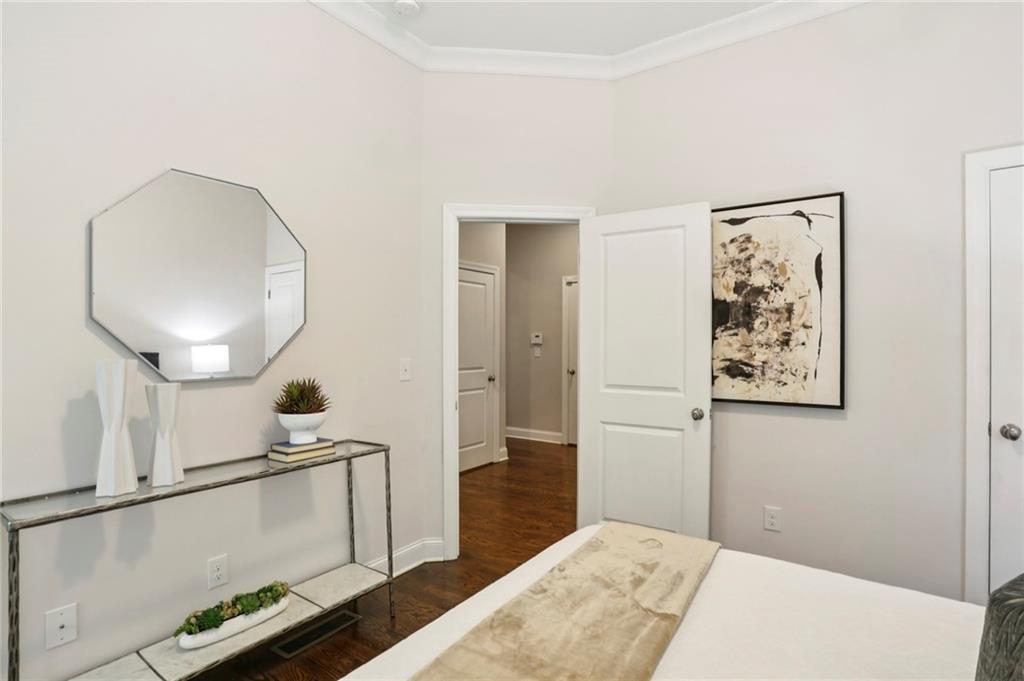 2585 Drew Valley Road Northeast Brookhaven, GA 30319 - Photo 24 of 44 a bedroom with a bed and a chandelier