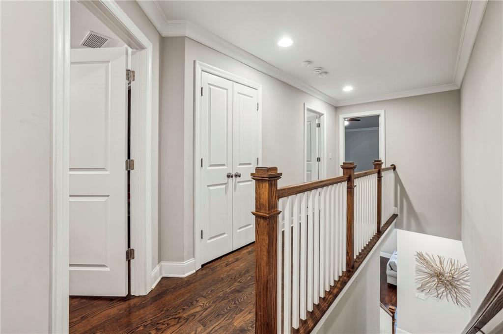 2585 Drew Valley Road Northeast Brookhaven, GA 30319 - Photo 28 of 44 a view of a hallway with wooden floor and staircase