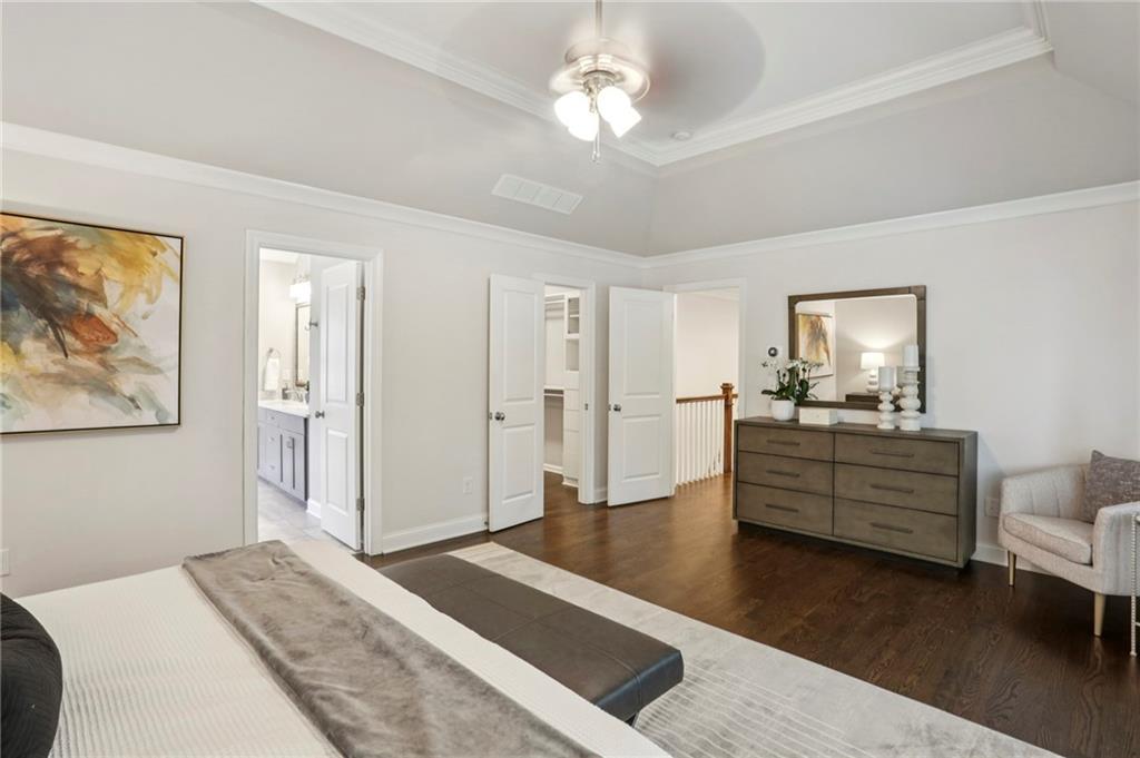 2585 Drew Valley Road Northeast Brookhaven, GA 30319 - Photo 30 of 44 a bed room with a bed and a chandelier