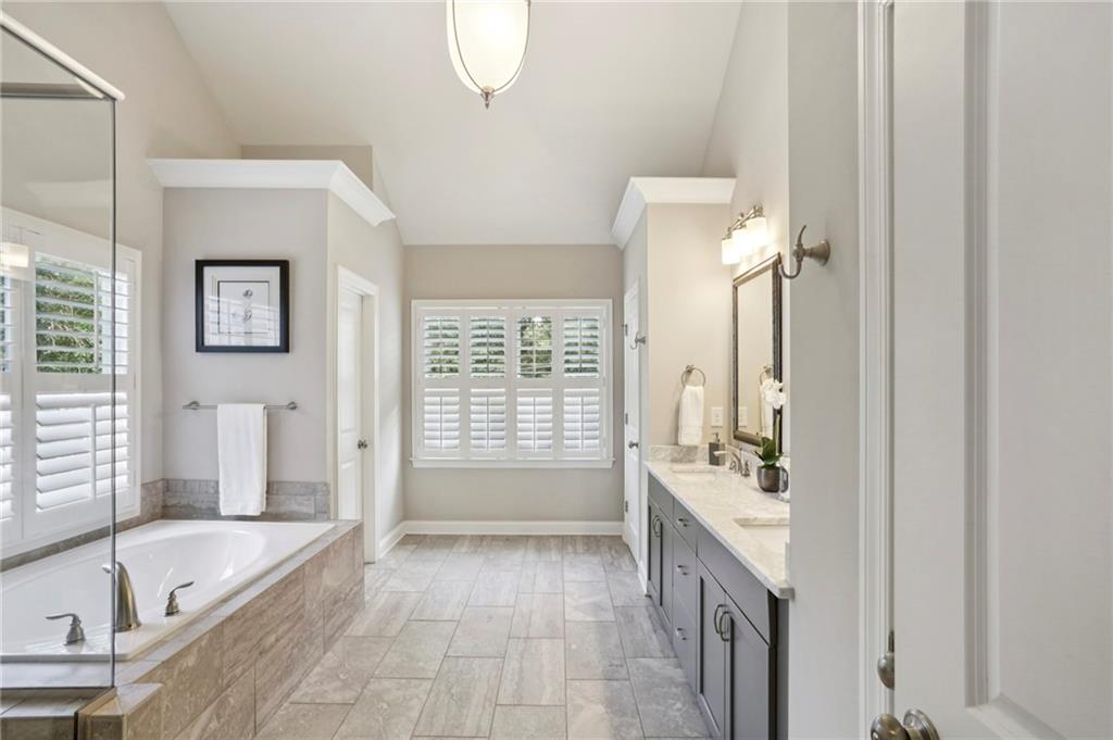 2585 Drew Valley Road Northeast Brookhaven, GA 30319 - Photo 33 of 44 a bathroom with a tub sink and mirror