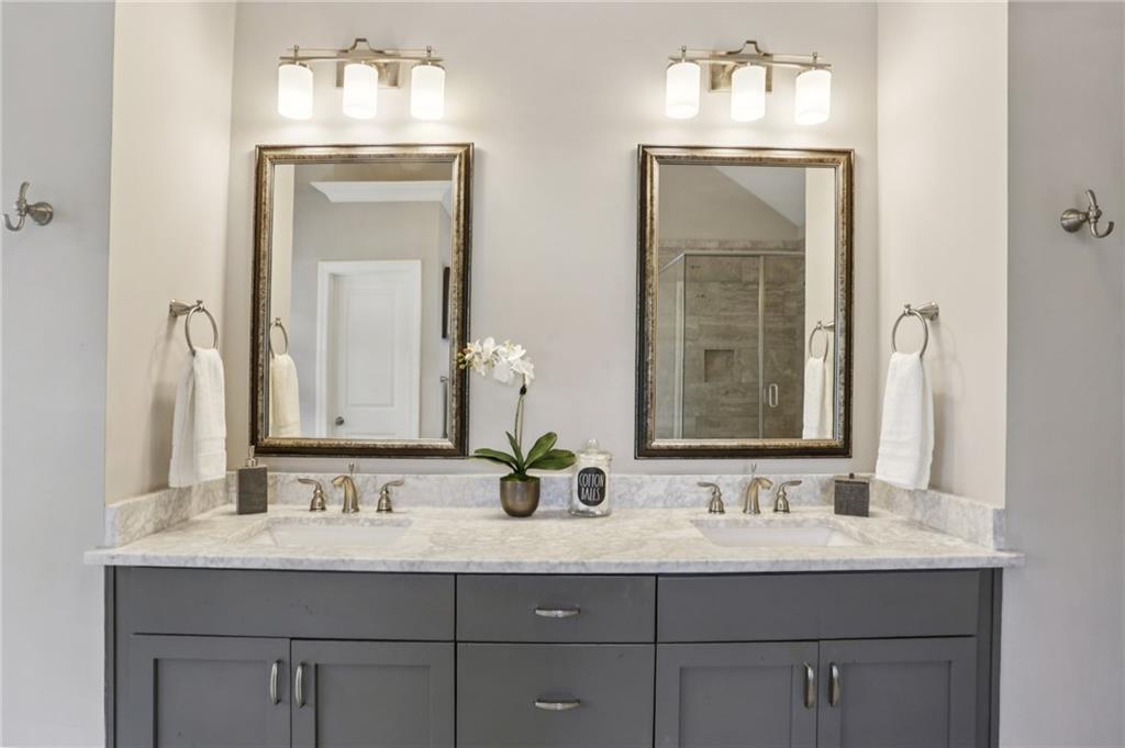 2585 Drew Valley Road Northeast Brookhaven, GA 30319 - Photo 34 of 44 a bathroom with double vanity sinks and a mirror