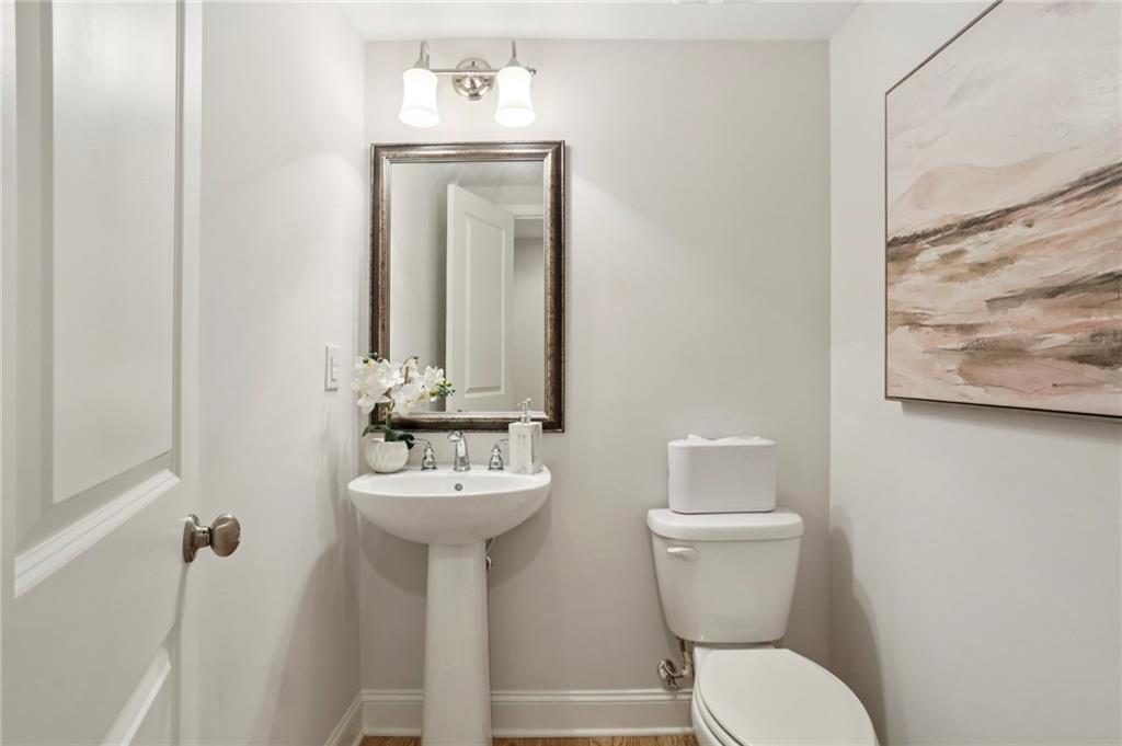 2585 Drew Valley Road Northeast Brookhaven, GA 30319 - Photo 35 of 44 a bathroom with a toilet sink and mirror