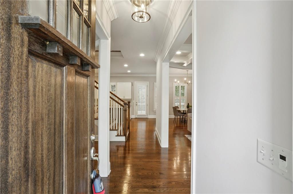 2585 Drew Valley Road Northeast Brookhaven, GA 30319 - Photo 4 of 44 a view of a hallway with wooden floor and staircase