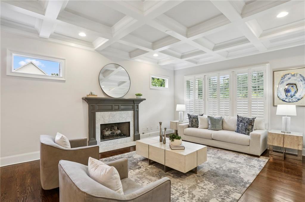2585 Drew Valley Road Northeast Brookhaven, GA 30319 - Photo 8 of 44 a living room with furniture a fireplace and a large window