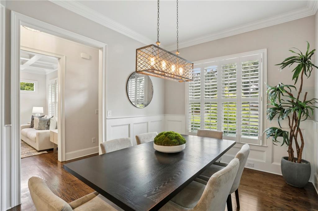 2585 Drew Valley Road Northeast Brookhaven, GA 30319 - Photo 9 of 44 a view of a dining room and livingroom with furniture wooden floor and a chandelier