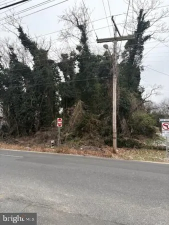 a view of a house with a snow on the road