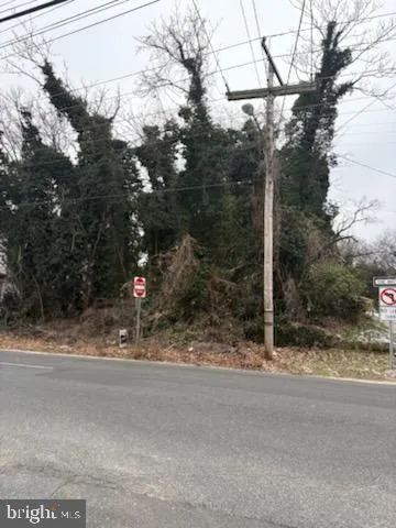 a view of a house with a snow on the road