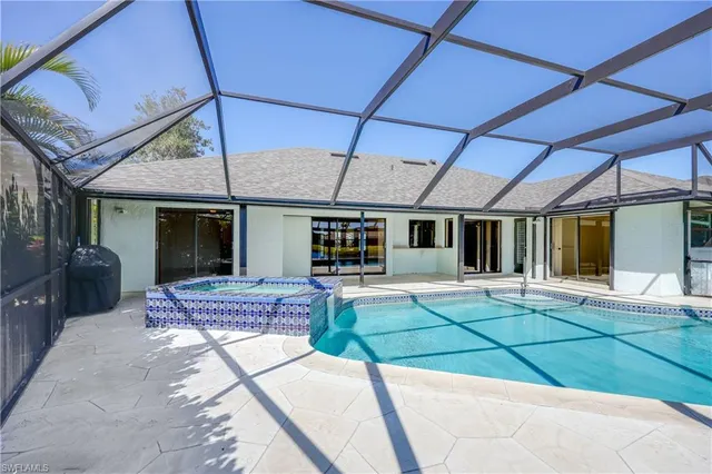 a swimming pool with a outdoor seating