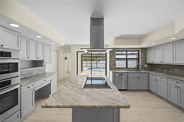 a kitchen with a refrigerator and a sink