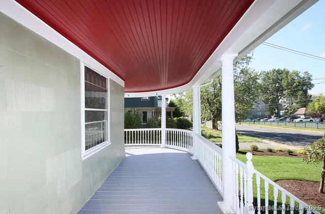 a view of a deck with wooden floor and wooden fence