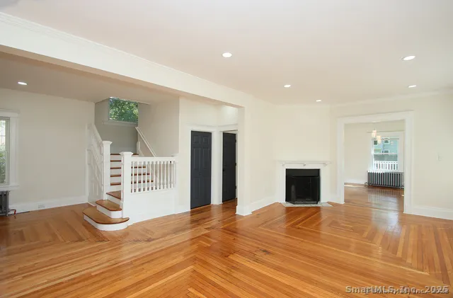 a bedroom with a bed and a television