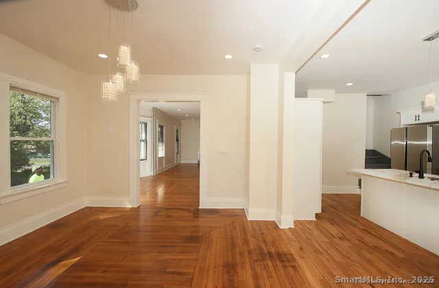 a view of a kitchen cabinets and wooden floor
