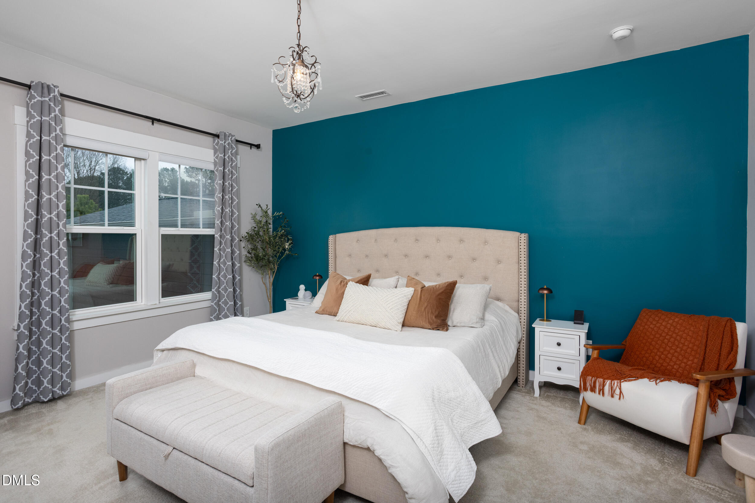 469 Rally Point Place Wake Forest, NC 27587 - Photo 16 of 37 a bedroom with a bed chair and window