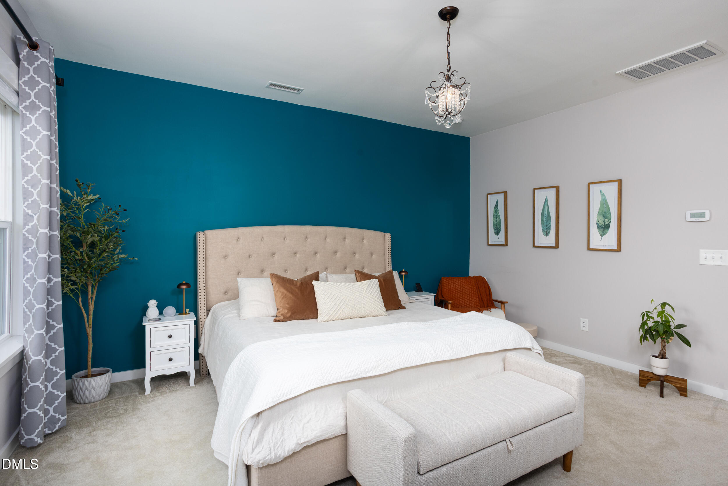 469 Rally Point Place Wake Forest, NC 27587 - Photo 17 of 37 a bedroom with a bed and a chandelier