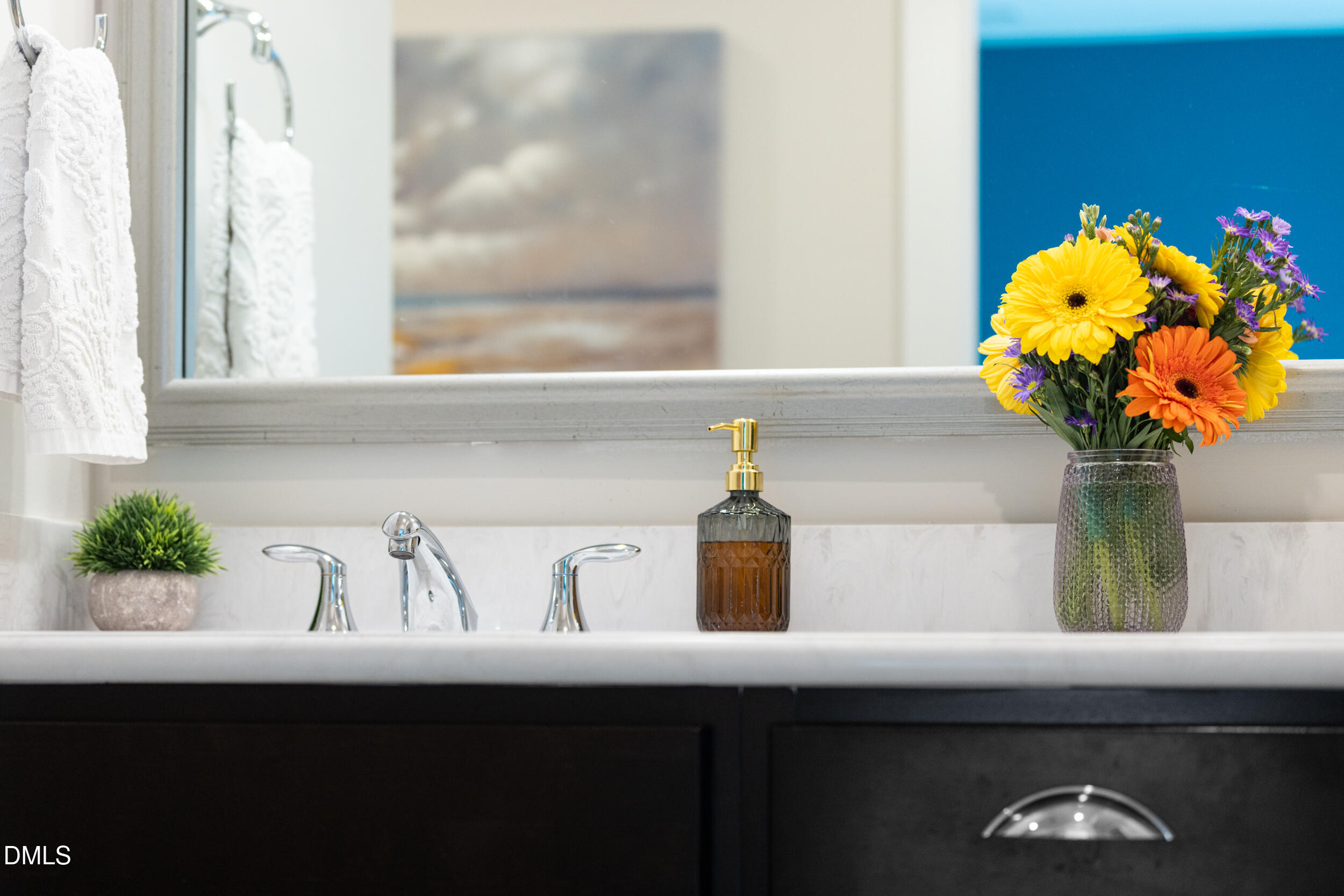 469 Rally Point Place Wake Forest, NC 27587 - Photo 19 of 37 a vase of flowers sitting on a sink