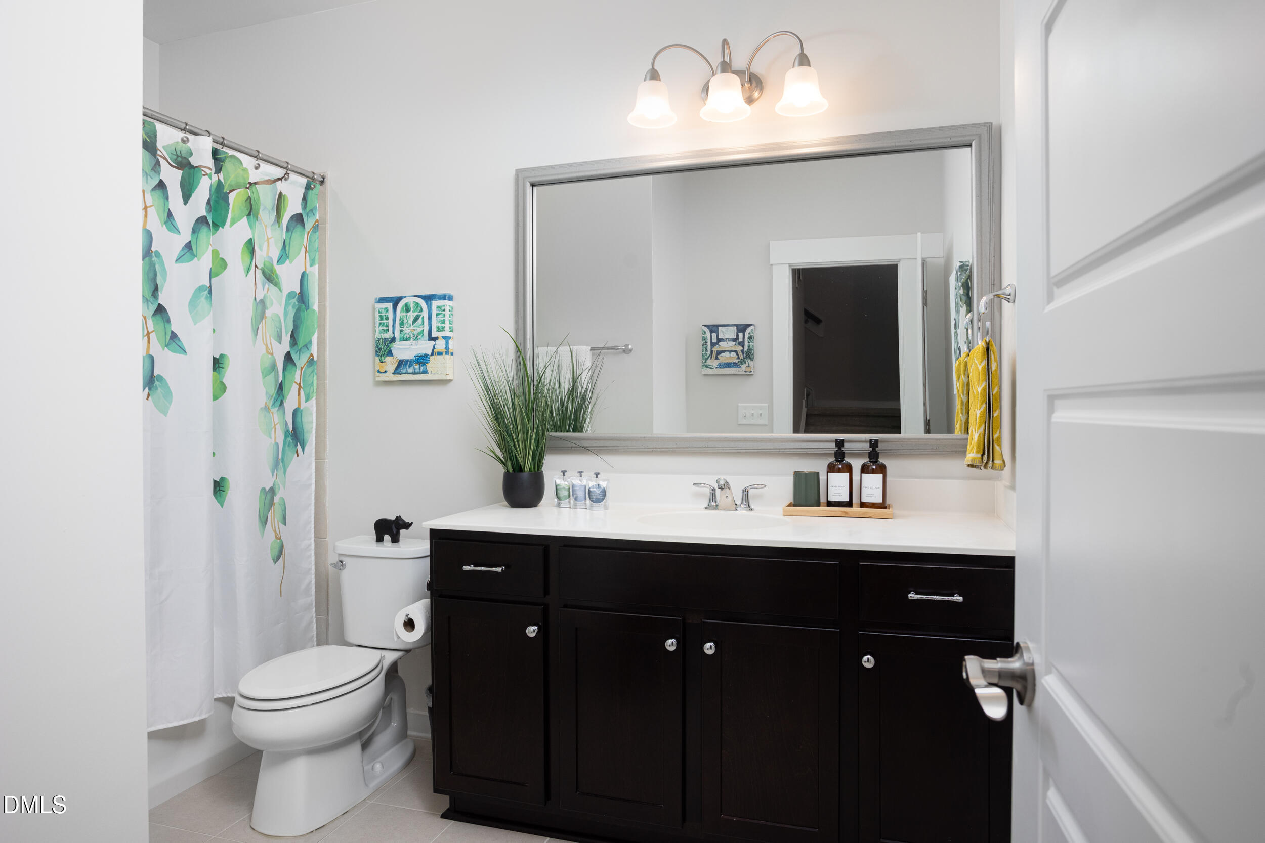469 Rally Point Place Wake Forest, NC 27587 - Photo 26 of 37 a bathroom with a toilet sink and mirror