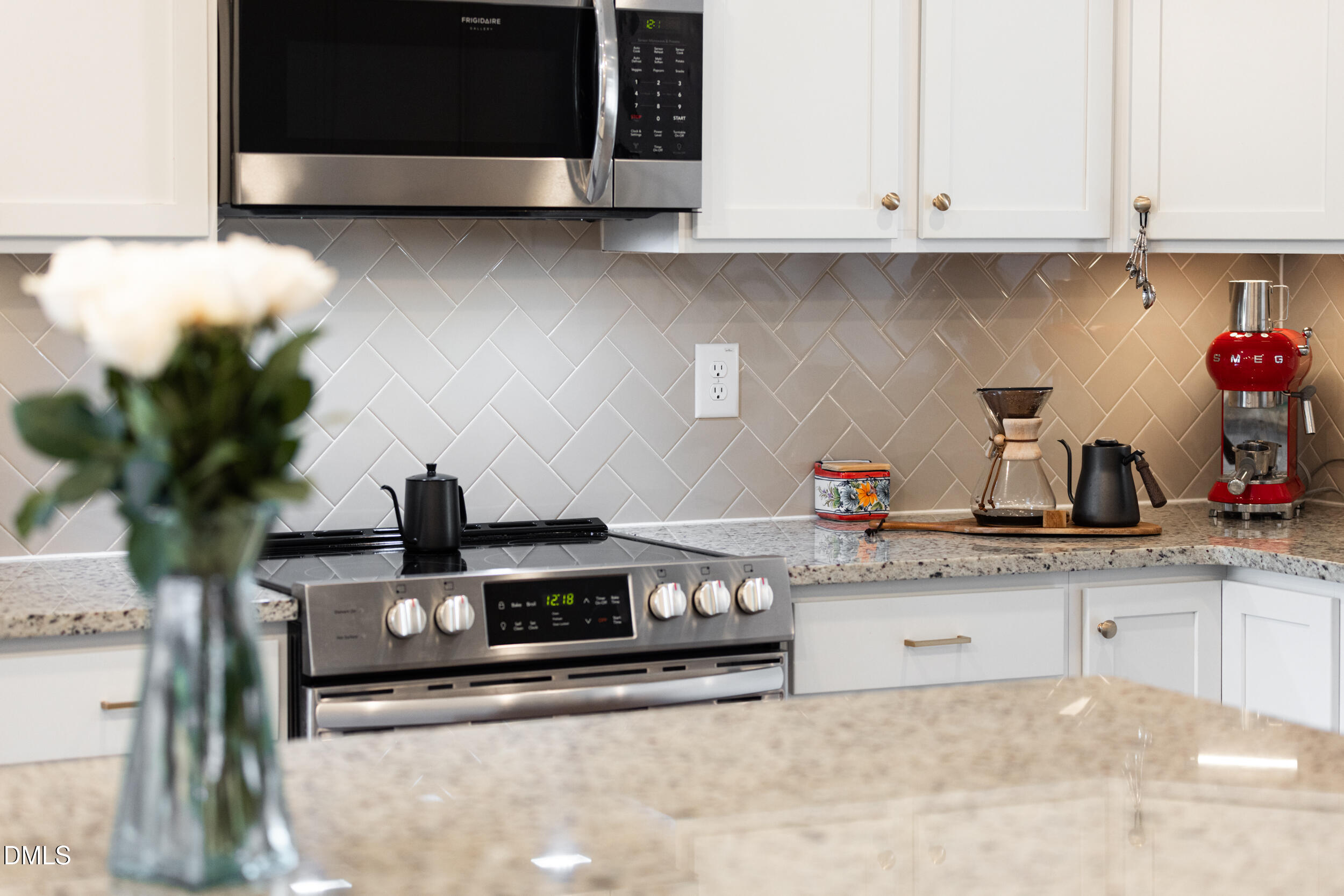 469 Rally Point Place Wake Forest, NC 27587 - Photo 5 of 37 a kitchen with stainless steel appliances granite countertop a sink and a microwave